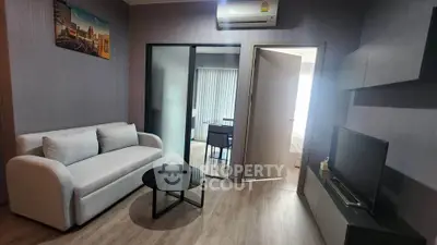 Modern living room with sleek furniture and air conditioning in a stylish apartment.