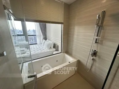 Luxurious bathroom with bathtub and city view in modern apartment