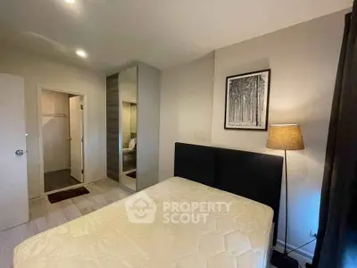 Cozy bedroom with modern decor and ample natural light