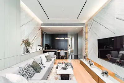 Luxurious modern living room with sleek design and open layout, featuring elegant decor and a spacious feel.