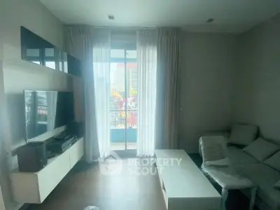 Modern living room with balcony view and sleek furniture