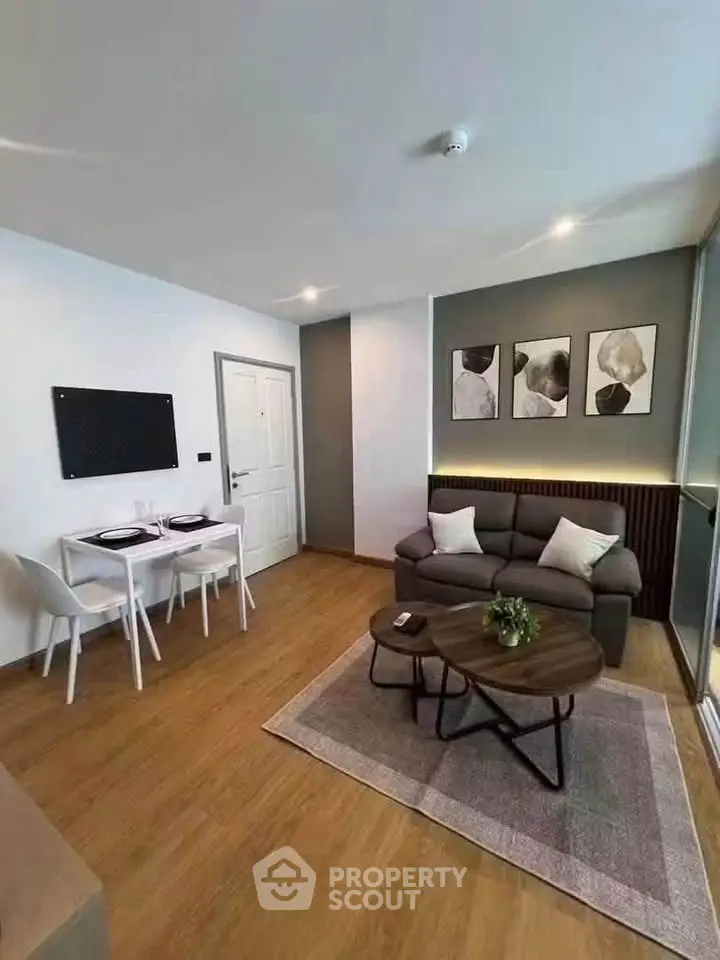 Modern living room with stylish decor and cozy seating area, perfect for relaxation and entertaining.
