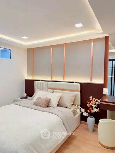 Elegant bedroom with modern lighting and cozy decor