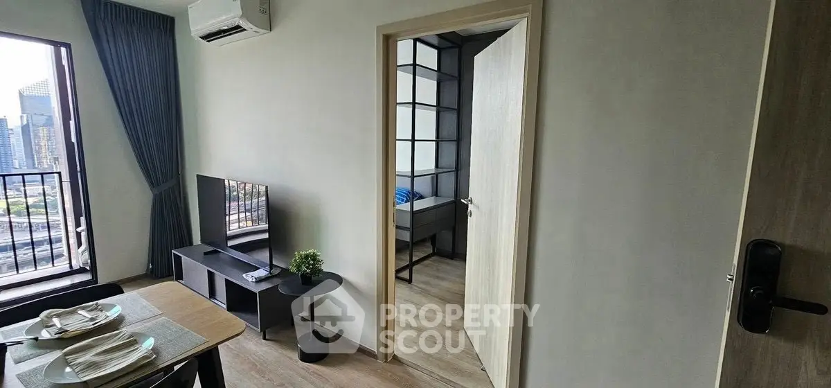 Modern apartment interior with dining area and city view balcony