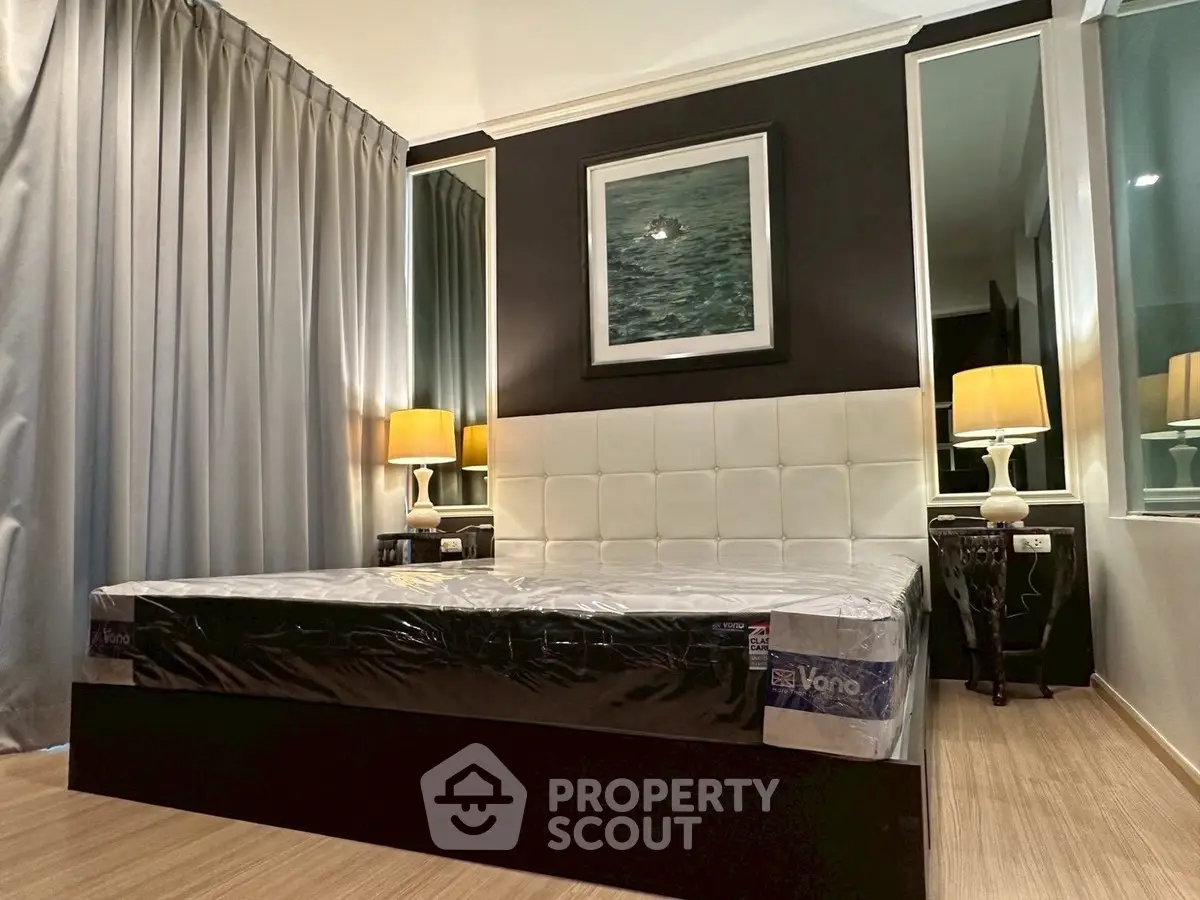 Luxurious bedroom with elegant decor and ambient lighting, featuring a plush bed and stylish nightstands.