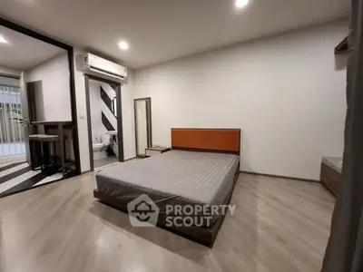 Spacious modern bedroom with minimalist design and natural light