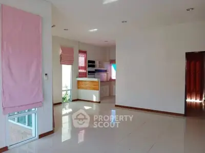 Spacious open-plan living area with natural light and modern finishes.