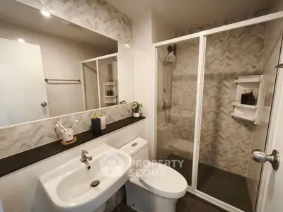 Modern bathroom with sleek shower and stylish tiles