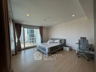 Spacious modern bedroom with city view and elegant furnishings