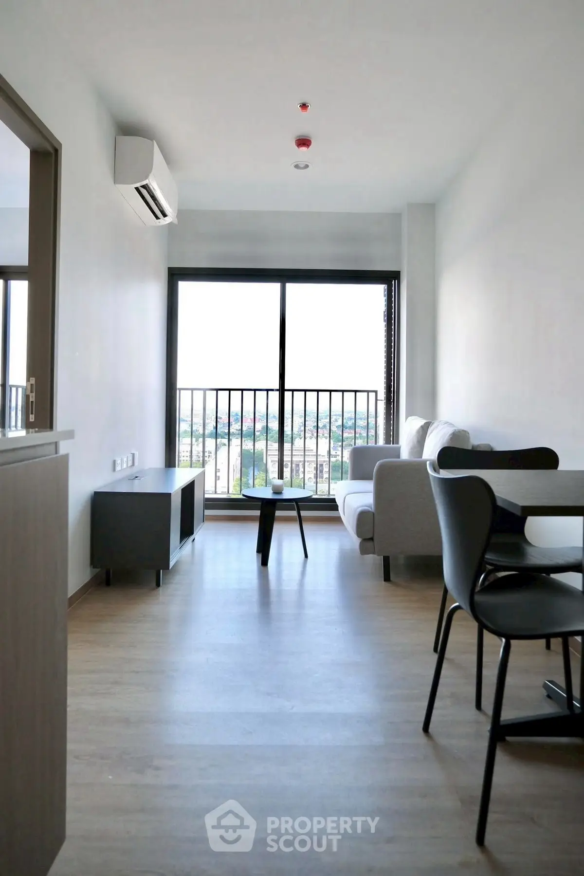 Modern living room with balcony view and sleek furniture