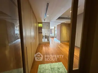 Spacious modern living room with wooden flooring and stylish decor
