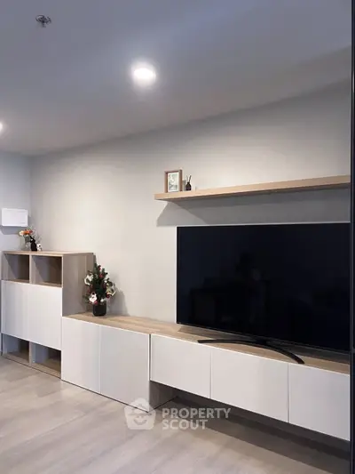 Modern living room with sleek TV unit and stylish decor