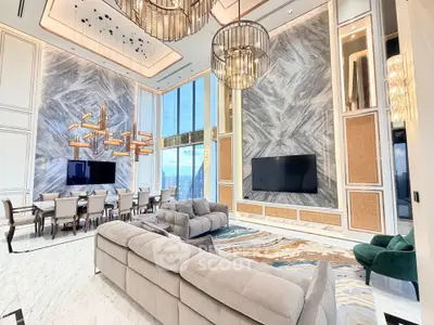 Luxurious high-ceiling living room with modern decor and stunning city view
