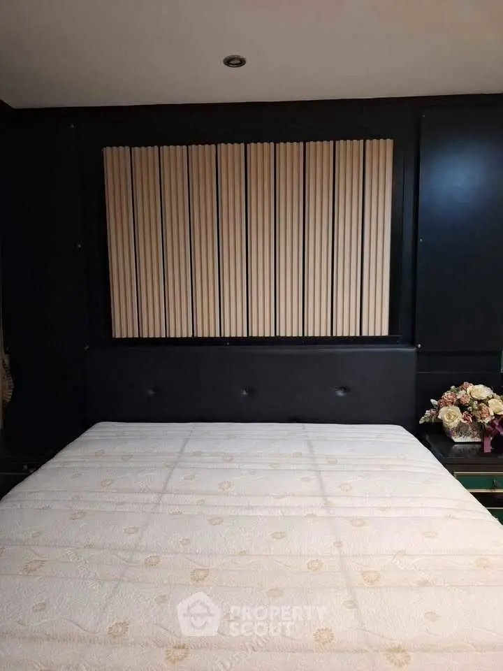 Luxurious bedroom with elegant decor and comfortable bedding