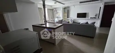 Modern living room with open kitchen and stylish decor