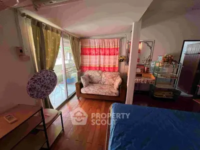 Cozy bedroom with balcony access and charming decor