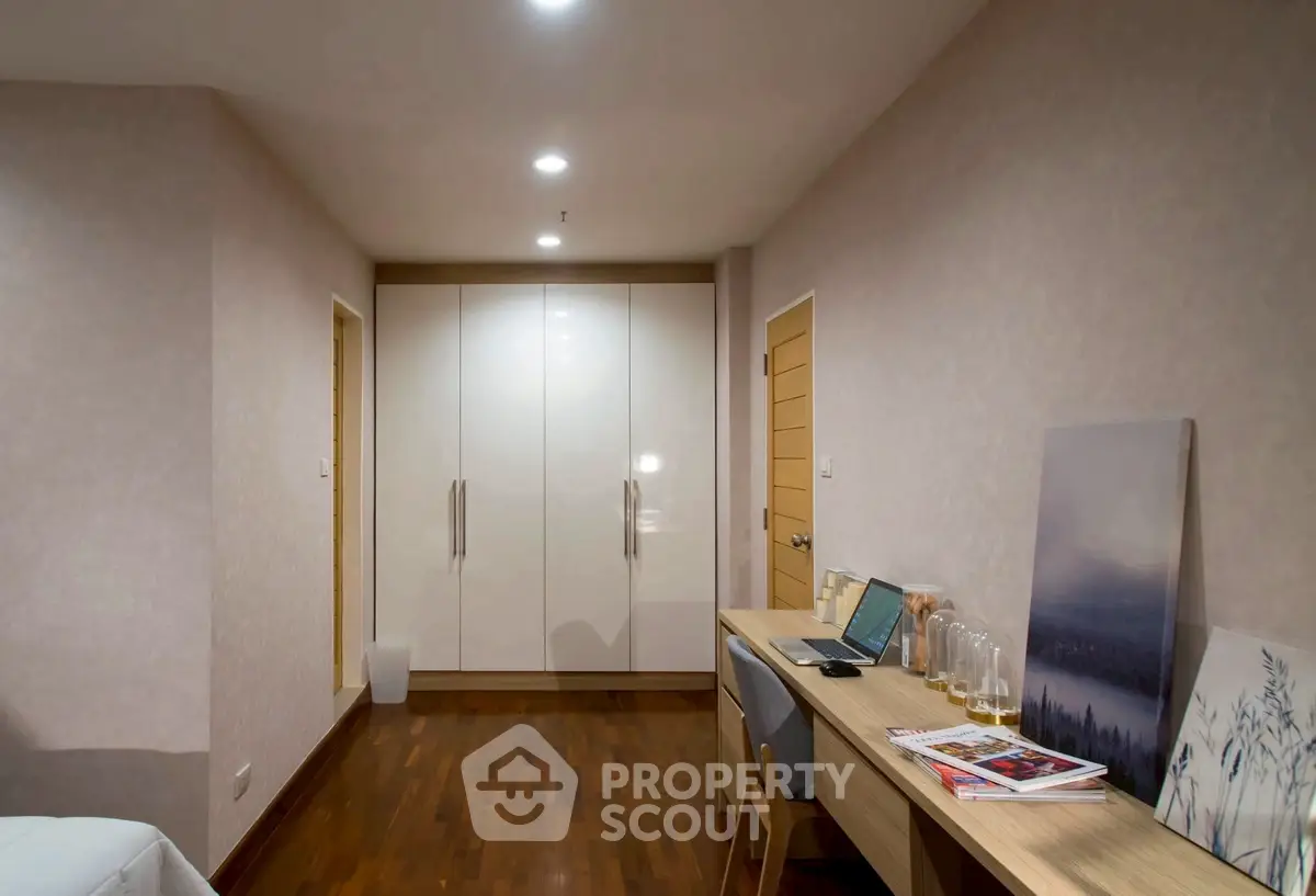 Modern study room with sleek desk and ample storage space