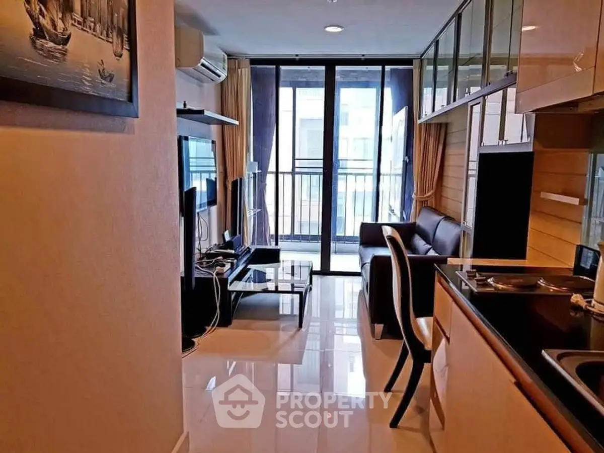 Modern living room with sleek furniture and balcony view in urban apartment