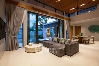 Luxurious modern living room with pool view and elegant decor