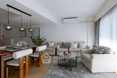 Modern living room with elegant dining area and stylish decor