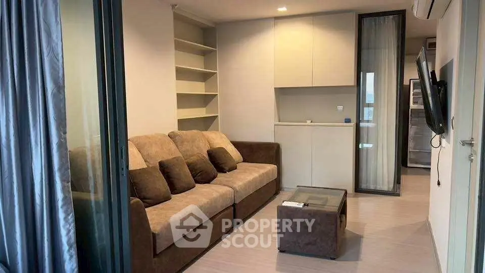 Modern living room with cozy sofa and sleek design, perfect for relaxation and entertainment.