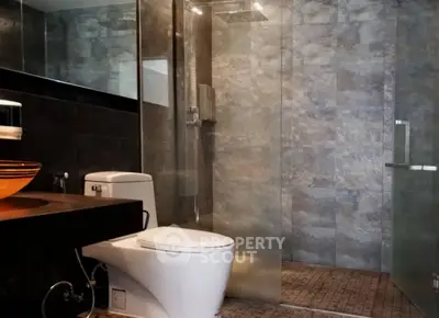 Modern bathroom with glass shower and stylish sink