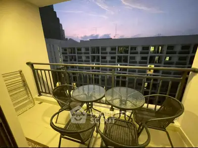 Charming balcony with city view, perfect for evening relaxation and outdoor dining.