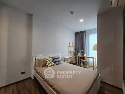 Modern bedroom with stylish decor and natural light