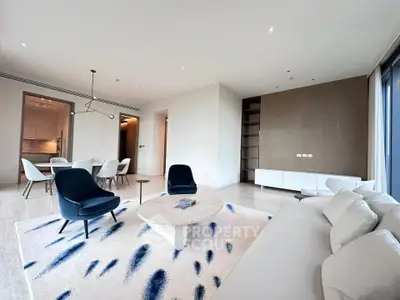 Spacious modern living room with elegant furniture and open layout, perfect for entertaining.