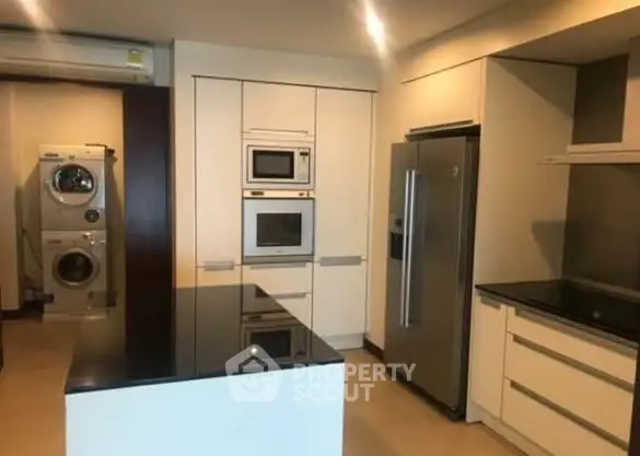 Modern kitchen with sleek appliances and island counter