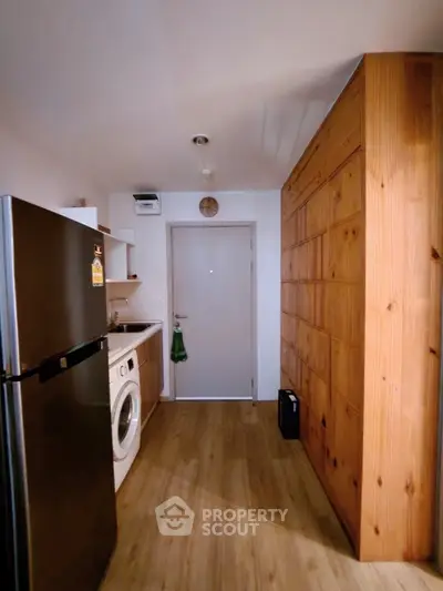 Cozy kitchen with wooden cabinetry and modern appliances