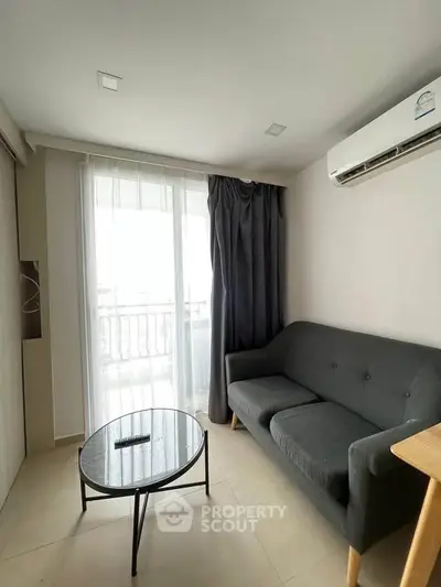 Cozy living room with modern sofa and balcony view