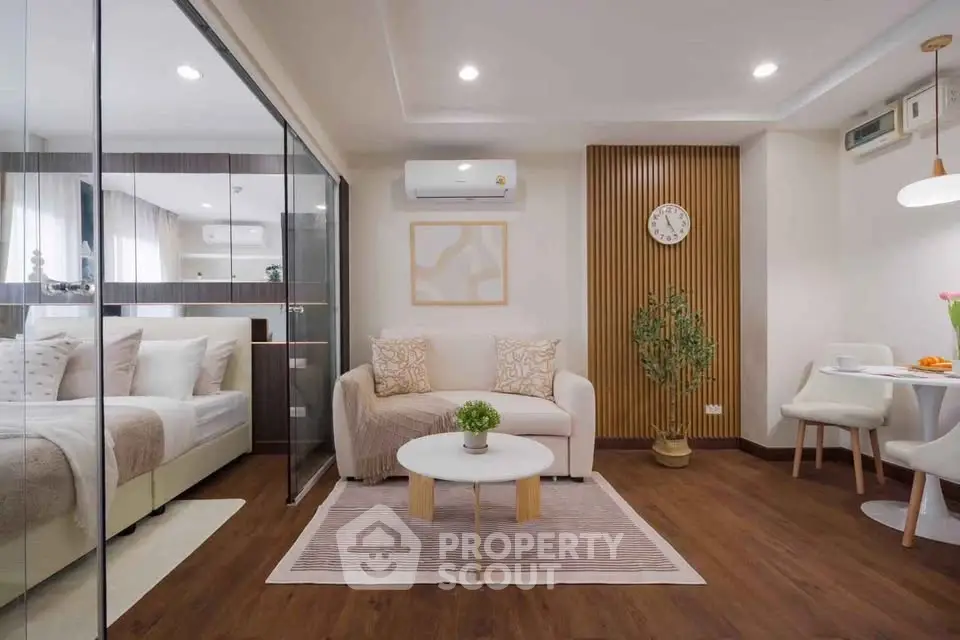 Modern open-concept living room with cozy seating and stylish decor