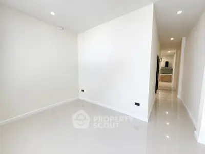 Spacious modern interior with sleek tile flooring and minimalist design, perfect for customization.