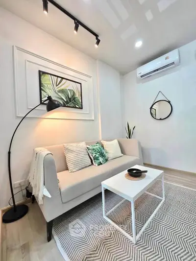 Chic modern living room with stylish decor, cozy sofa, and elegant lighting, perfect for urban living.