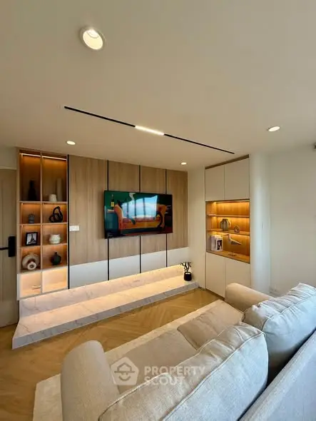 Modern living room with stylish built-in shelves and cozy seating area