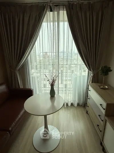 Cozy living room with elegant curtains and city view