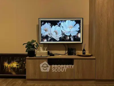 Stylish living room with modern TV setup and elegant wooden furniture