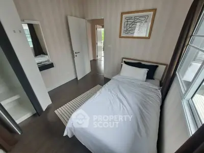 Cozy single bedroom with modern decor and ample natural light