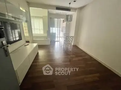 Modern living room with sleek flooring and stylish furniture in a contemporary apartment.
