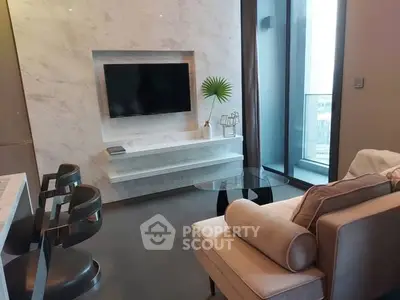 Modern living room with sleek marble TV wall and cozy seating area