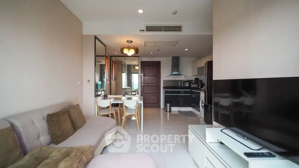 Modern living room with open kitchen and stylish decor