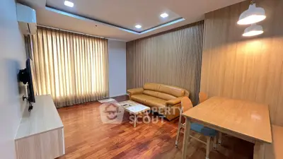 Modern living room with wooden flooring and stylish furniture