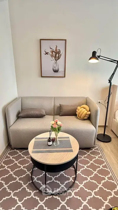Stylish living room with modern sofa, chic decor, and elegant lighting, perfect for cozy relaxation.