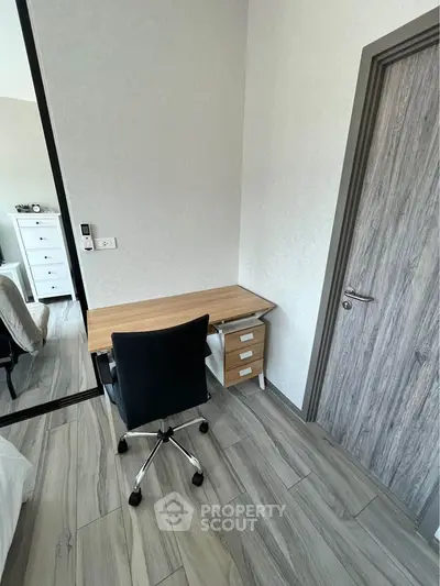 Cozy study nook with modern desk and chair in stylish apartment