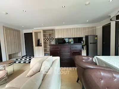 Spacious living room with modern furniture and open kitchen layout