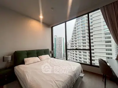 Modern bedroom with city view in high-rise apartment