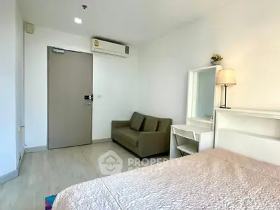 Cozy bedroom with sofa and modern decor in a bright apartment