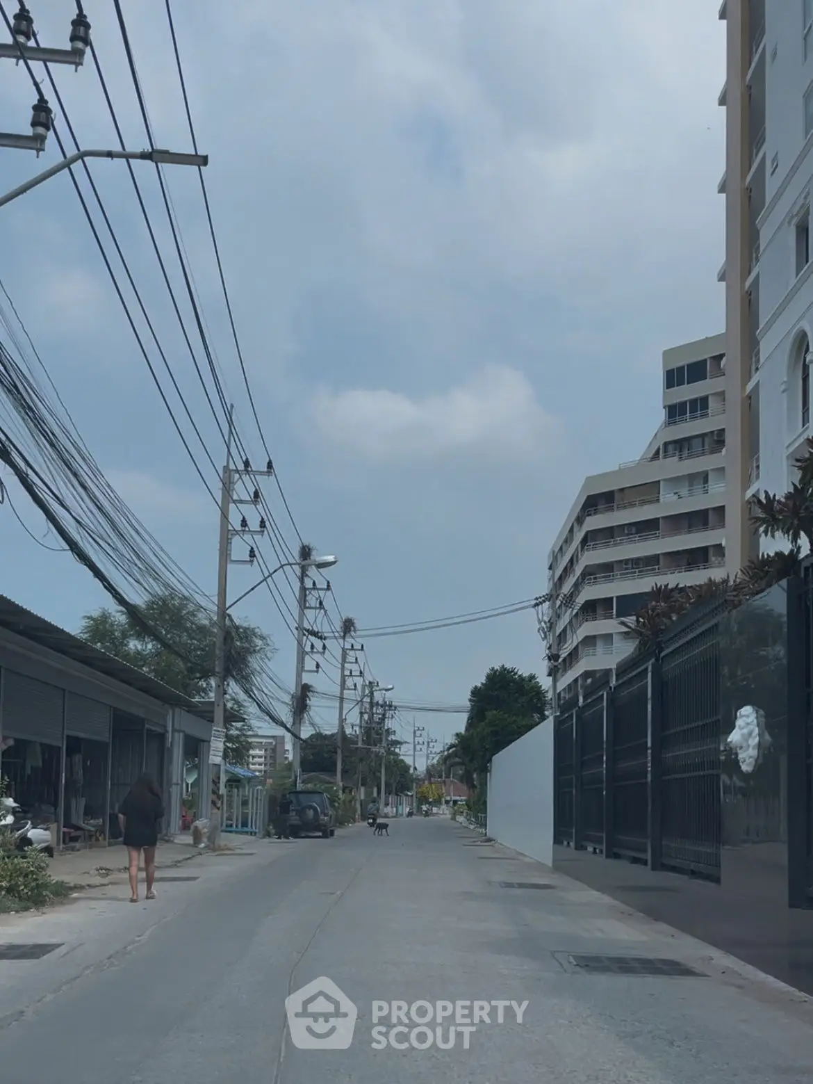 Urban street view with residential buildings and clear sky