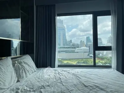 Luxurious bedroom with stunning city view from large window